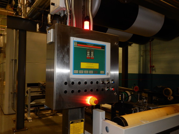 A small green and yellow cargo truck with an open back.