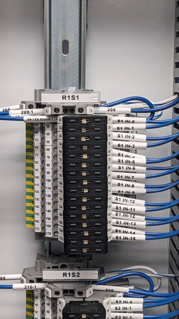 A small green and yellow cargo truck with an open back.