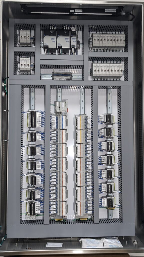 A small green and yellow cargo truck with an open back.